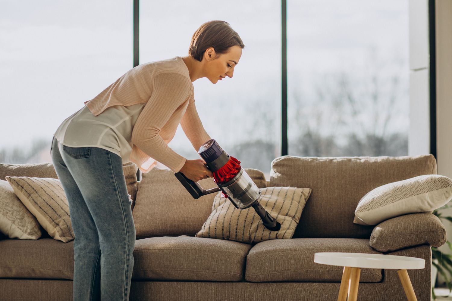 woman cleaning sofa